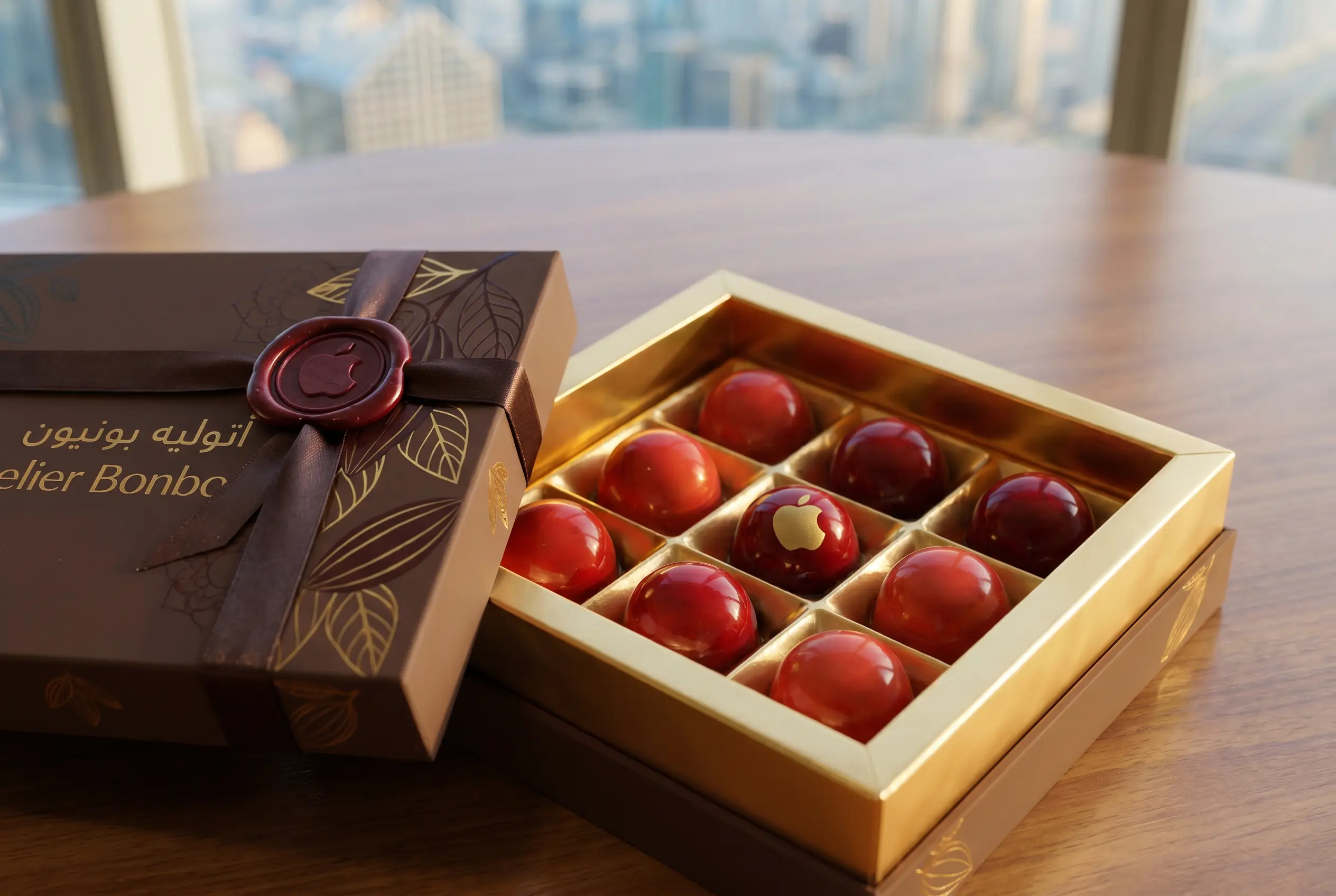 Corporate chocolate gift boxes Dubai — multiple artisan chocolate boxes in branded gift bag